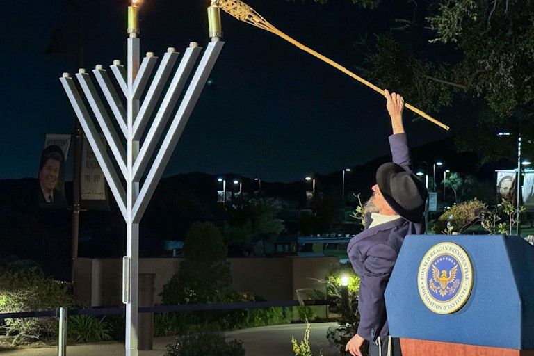 Person lighting the Menorah