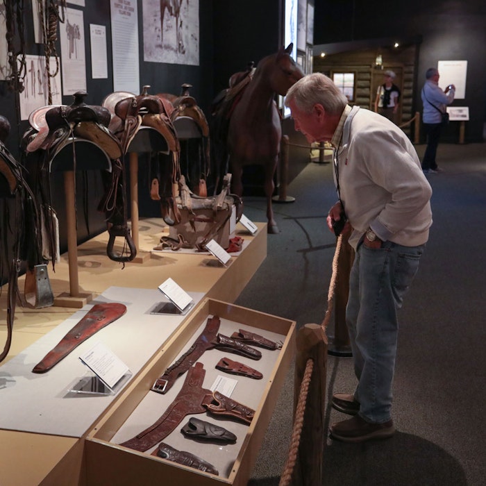 Guests looking at the exhibit pieces