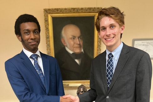 RRDS Debate Students 2 students shaking hands