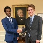 RRDS Debate Students 2 students shaking hands