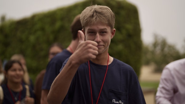 Student with Thumbs Up