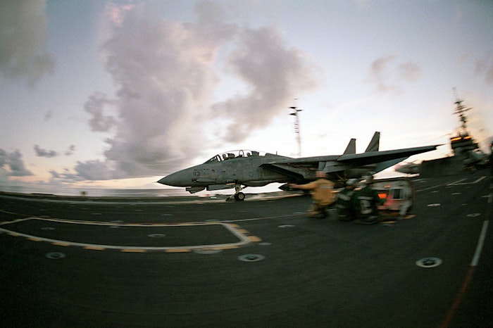 An F-14 "Tomcat" launches from the flight deck of the USS KITTY HAWK (CV 63)