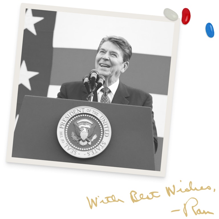 Photo of Ronald Reagan at a podium. Signed "With Best Wishes, - Ronnie".