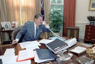 Reagan on phone at his desk Reagan on phone at his desk