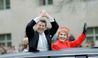 Ronald and Nancy Reagan waving from car