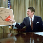 Reagan pointing at a graph on taxes Reagan pointing at a graph on taxes