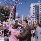 Nancy and Ronald Reagan celebrating at a parade