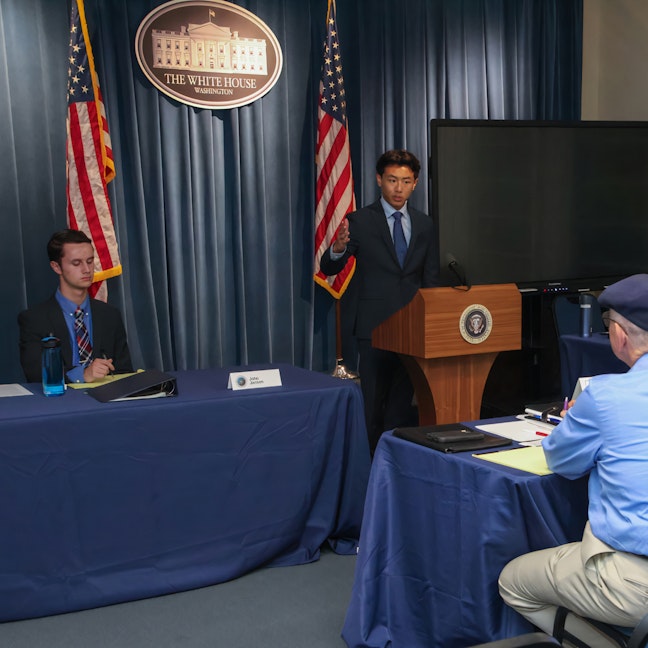 Debate participants at the podium