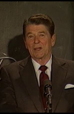 Remarks at Fudan University in Shanghai China April 30th 1984 Reagan speaking into microphone