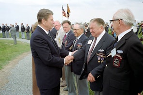 Reagan shaking hands with veterans