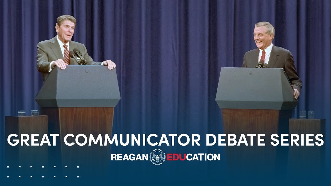 President Reagan standing at podium debating with opponent