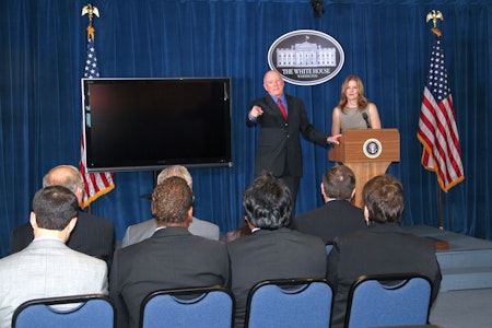 people on stage speaking to an audience