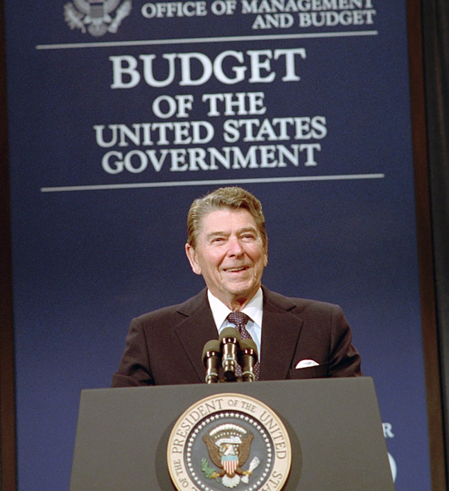 Reagan and the Budget of the United States Government President Reagan smiling at podium in front of blue sign that reads Budget of the United States Government