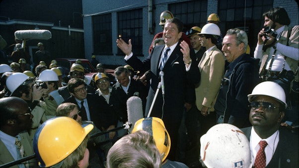 Reagan and Union Workers President Reagan speaking to a crowd of people in hard hats