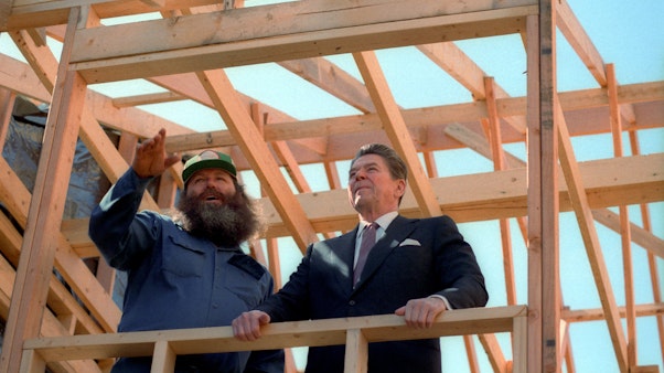 President Reagan a home construction site Reagan with a construction worker at a home site