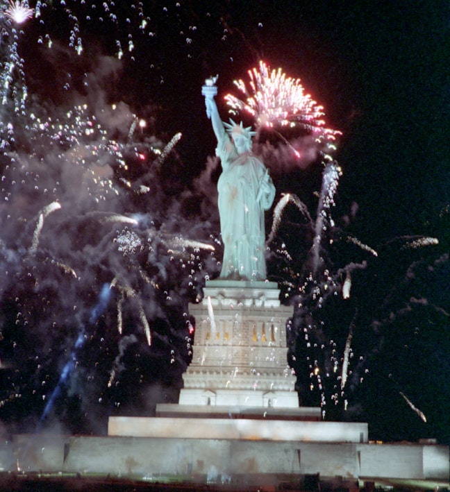 Fireworks Near The Statue of Liberty During a Trip to New York at The Opening Ceremonies of Liberty Weekend Governors Island Fireworks behind the Statue of Liberty