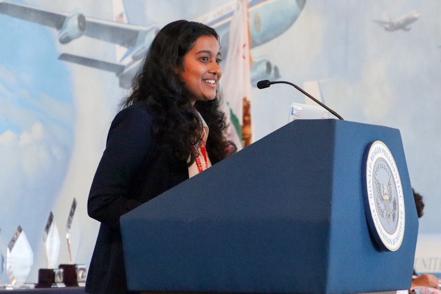 Person speakign on a podium.